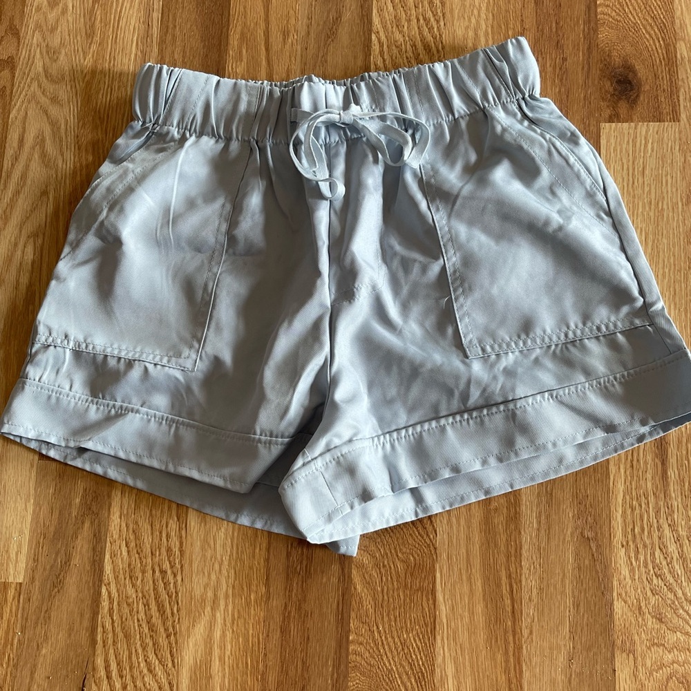 Brand new never even tried on. They are a light gray. Size small.